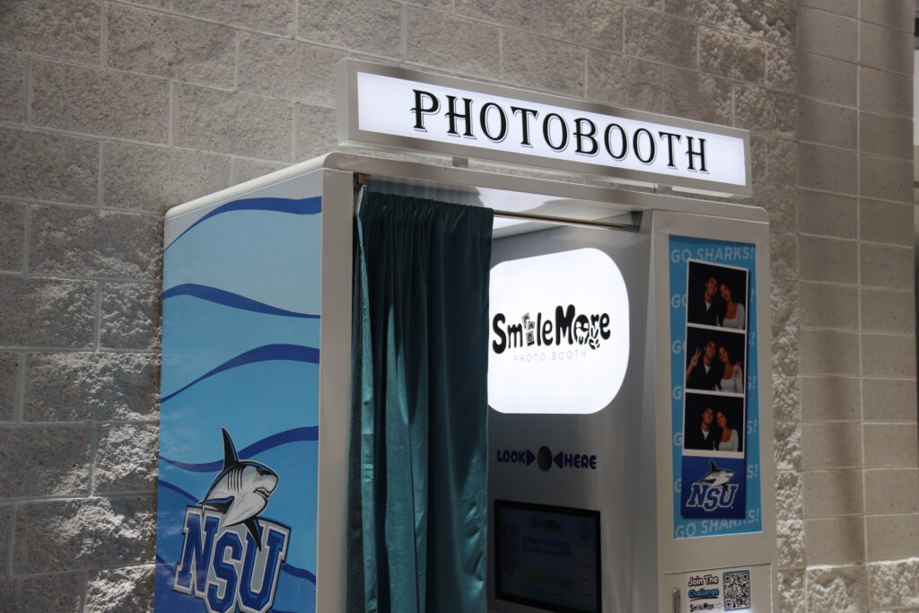 Front view of the SmileMore photo booth with the curtain open at NSU