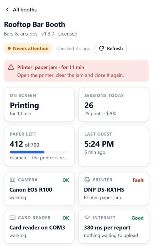 The VertexBooth fleet monitor on a phone showing a booth that needs attention