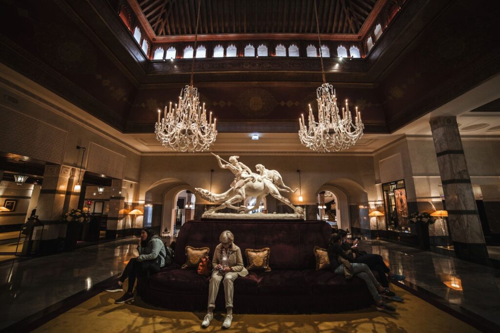A grand hotel lobby with chandeliers and seating, a typical home for a commercial photo booth