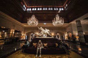 A grand hotel lobby with chandeliers and seating, a typical home for a commercial photo booth